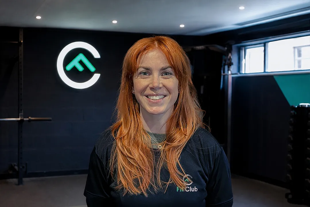 Portrait of Bex, Coach and NHS Physiotherapist at Fit Club York, inside the gym in York.