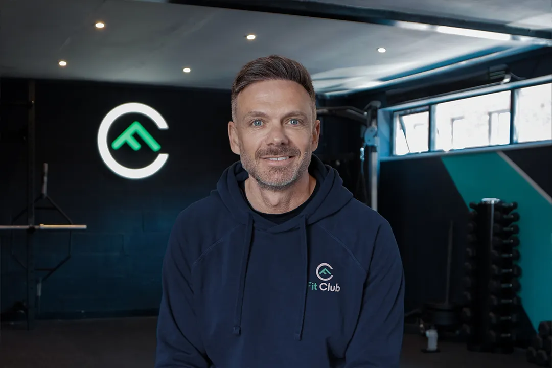 Portrait of Chris Hill, Owner and Personal Trainer at Fit Club York, inside the Fit Club gym in York.