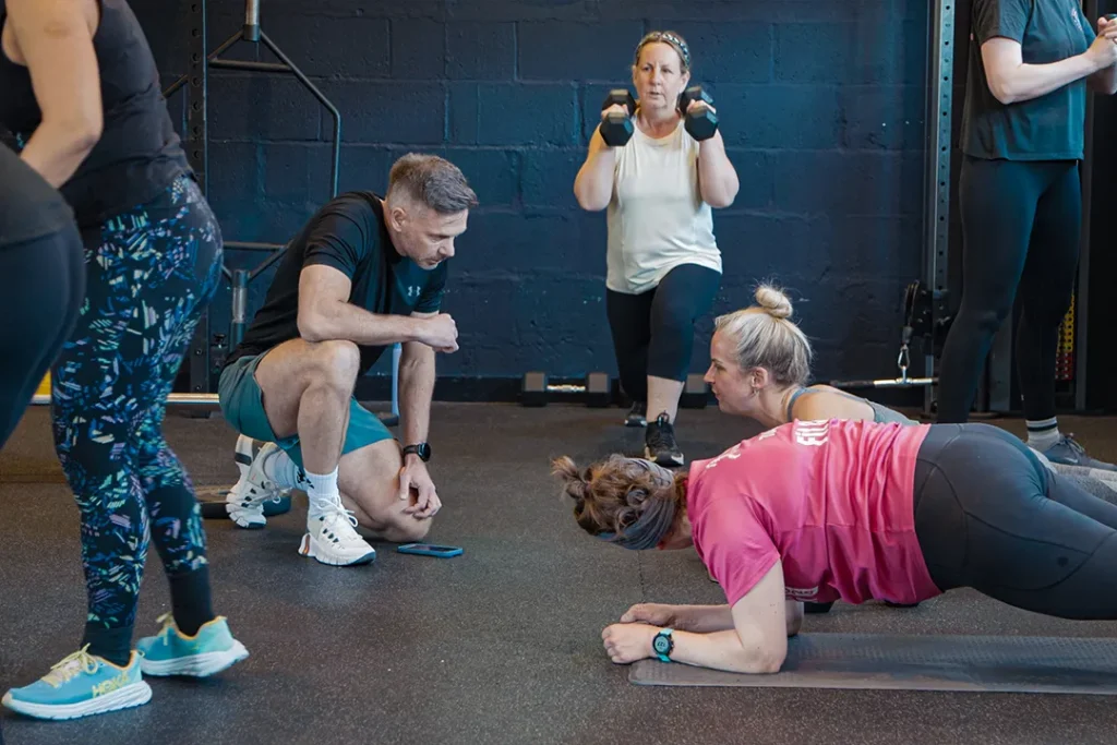 Chris Hill, Owner and Personal Trainer at Fit Club York, coaching members during a group fitness training session in York.