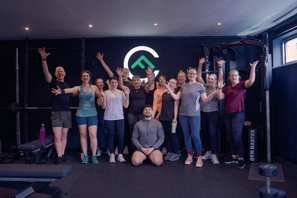 Fit Club York members and coach during a group training session inside the gym in York