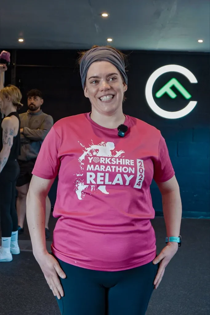 Fit Club York member Mary sharing her fitness and marathon training journey inside the gym