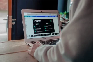 Fit Club York coach creating personalised workout programming on a laptop