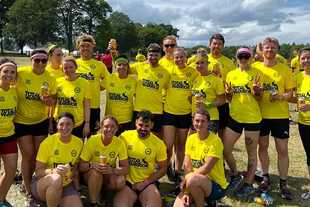 Fit Club York members posing together at Total Warrior Leeds 2026 obstacle course event