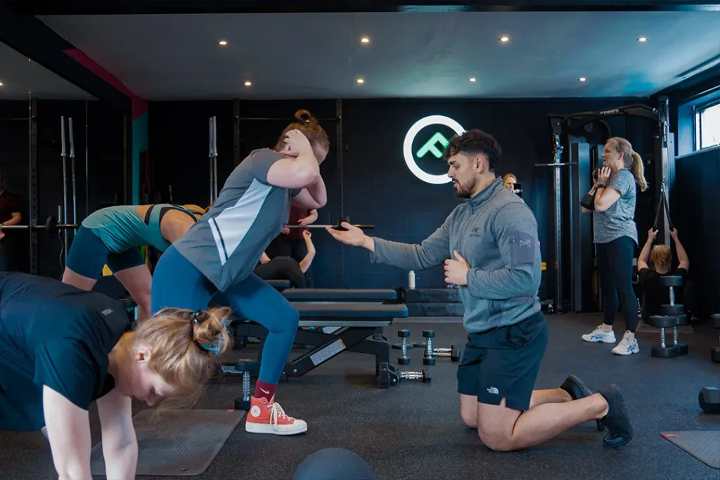 Rhys coaching members during a group training session at Fit Club York gym.